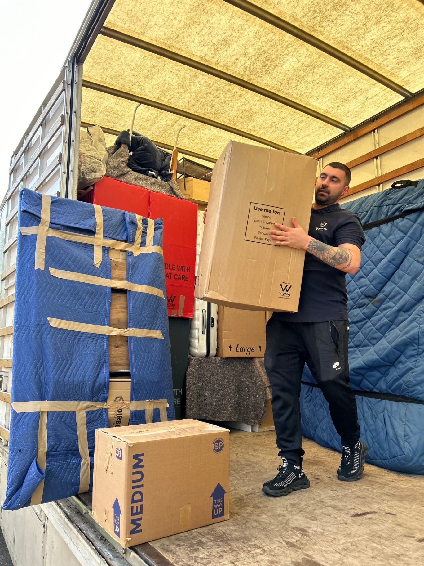 Hercules mover loading boxes into truck