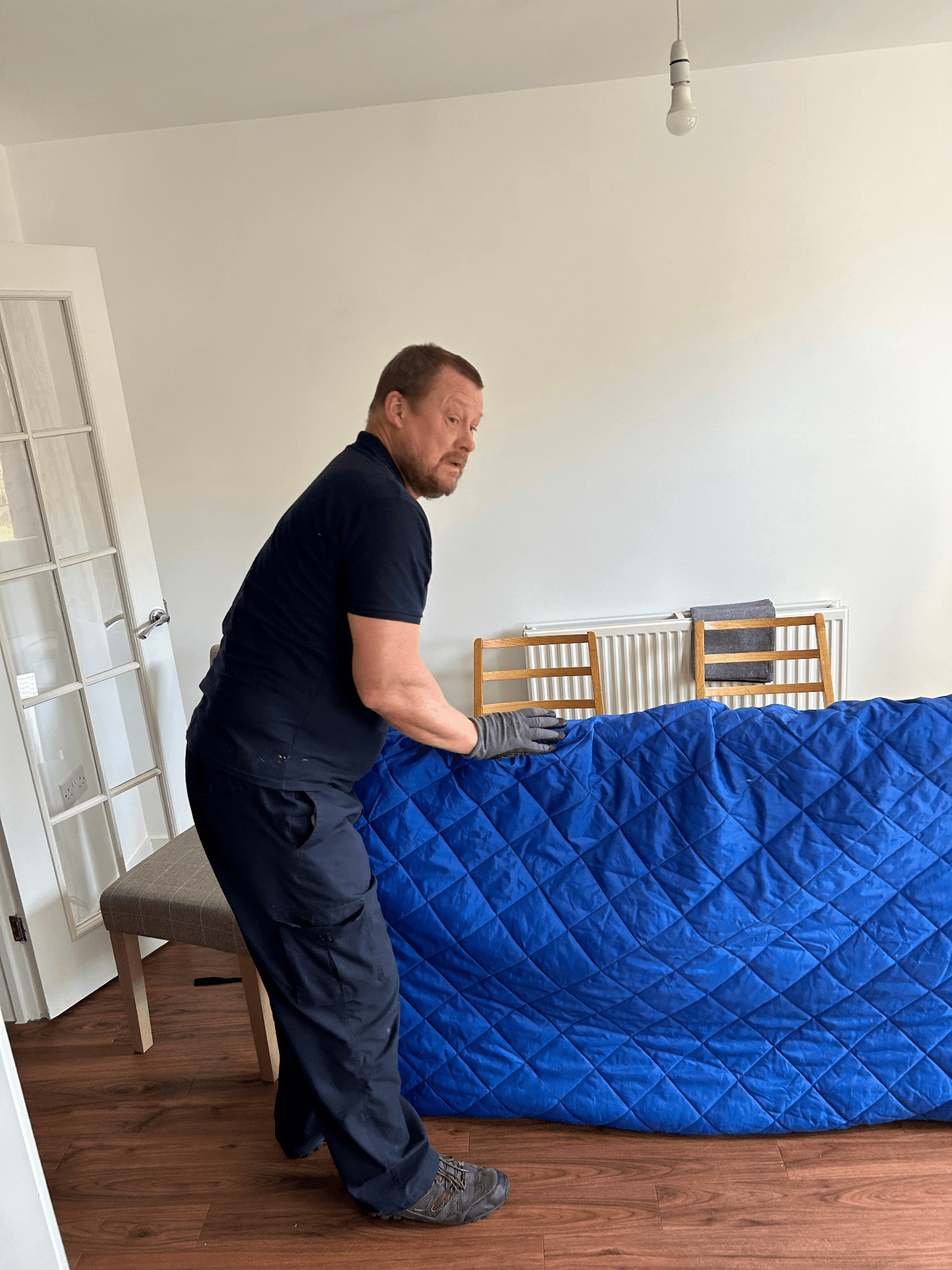 Hercules Movers branded van at customer home