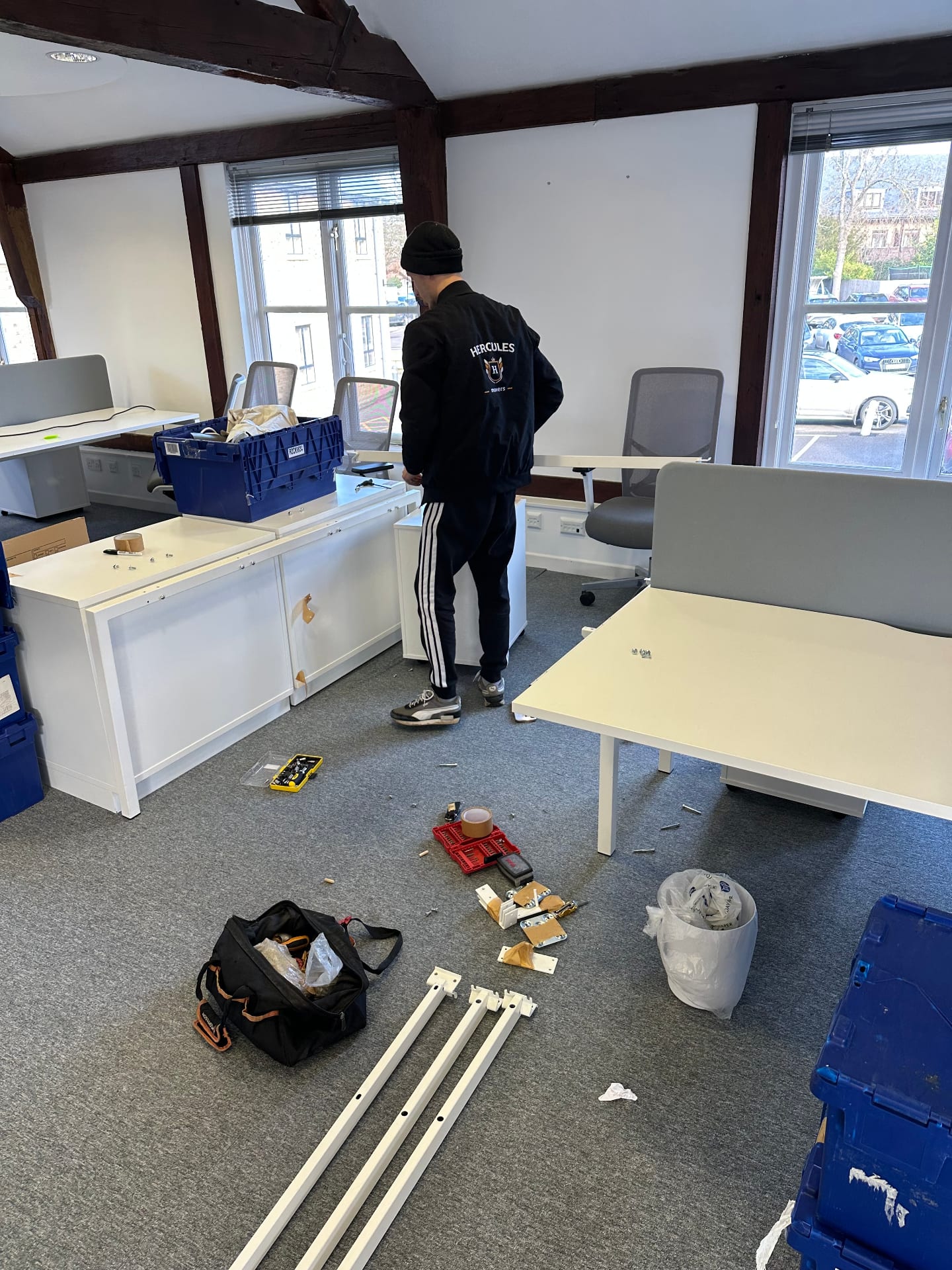 Hercules mover protecting office IT equipment with shrink wrap